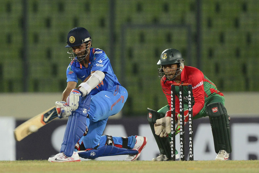 Ajinkya Rahane sweeps the ball (Photo: Cricinfo/BCB)