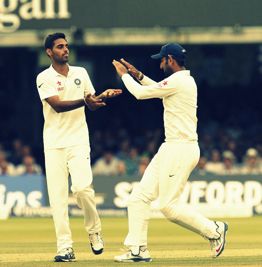 Indian Players Bhuvneshwar & Pujara having some fun moments after taking a Wicket against England