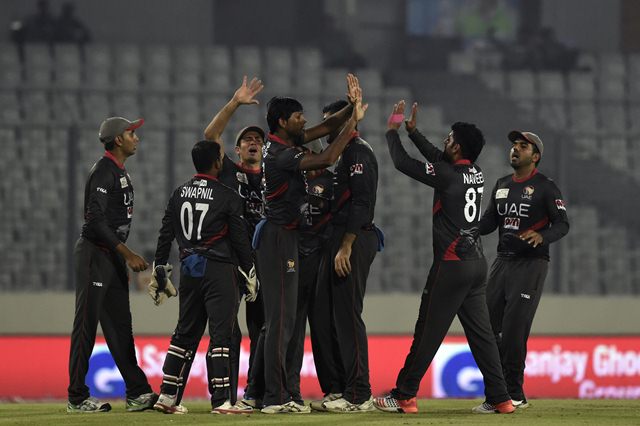 United Arab Emirates cricketers celebrate after the dismissal