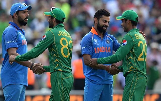 Virat Kohli and Yuvraj Singh of India shakes hands with Shadab Khan and Junaid Khan of Pakistan