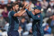 Liam Plunkett (L) and Jason Roy of England celebrate the wicket of Marcus Stoinis