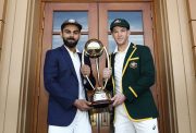 Virat Kohli and Tim Paine pose with the Border–Gavaskar Trophy