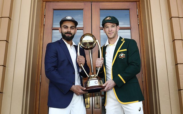 Virat Kohli and Tim Paine pose with the Border–Gavaskar Trophy