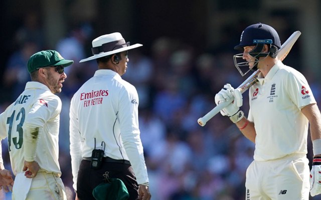 Joe Root speaks to Matthew Wade