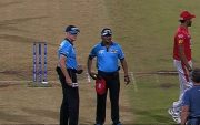 Umpire forgets that the ball is in his pocket