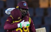 Nicholas Pooran congratulateS Chris Gayle of West Indies for reaching his half century