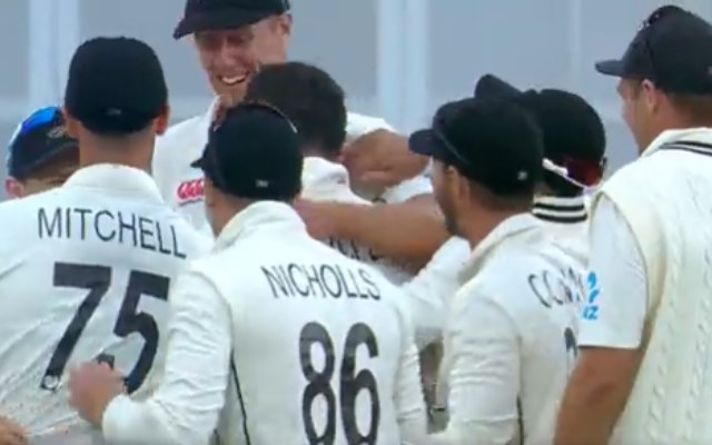 New Zealand players congratulate Ross Taylor after he gets a wicket