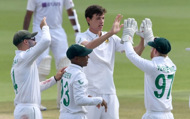 South African players celebrate the fall of a wicket